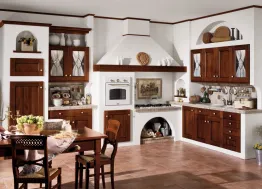 Cucina classica in muratura con elettrodomestici incassati nel muro, ante in pregiato legno scuro, pomelli in ceramica, finiture su richiesta Comp 04 di Arrex